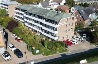 Wohnung kaufen in 25761 Büsum, Moderne 2-Zimmer-Dachgeschosswohnung mit Meerblick und Balkon in zentraler Lage von Büsum