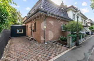 Einfamilienhaus kaufen in 40468 Düsseldorf, Düsseldorf - Charmantes Haus mit besonderer Architektur, großem Garten und Platz für die Familie