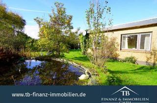 Haus kaufen in 26409 Wittmund, Wittmund - Burhafe: Stilvoller Flachdachbungalow mit Blick ins Grüne! #212