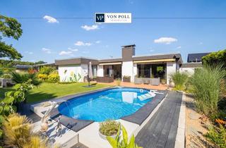 Haus kaufen in 41540 Dormagen, Stilvoller Bungalow mit Pool und liebevoll angelegtem Garten