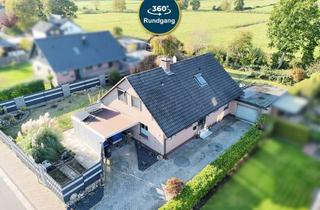 Einfamilienhaus kaufen in 26316 Varel, WOHNTRAUM MIT WEITBLICK IN BESTLAGE – EINFAMILIENHAUS MIT GARAGE, KAMIN UND NATURNAHER UMGEBUNG