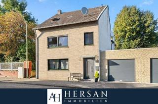 Einfamilienhaus kaufen in 52382 Niederzier, Niederzier / Ellen - Freistehendes Einfamilienhaus mit drei Garagen und Wintergarten - Mehrgenerationenhaus geeignet!