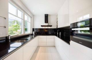 Wohnung kaufen in 82467 Garmisch-Partenkirchen, Mondänes Wohnen inmitten der Alpen – exklusive Gartenwohnung mit alpinem Charme