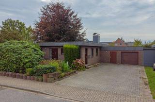 Haus kaufen in 24809 Nübbel, Gemütlicher Flachdachbungalow mit schön angelegtem Garten und praktischem Grundriss in ruhiger Lage in Nübbel