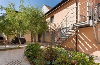 Mehrfamilienhaus kaufen in 65205 Nordenstadt, Topgepflegtes Mehrfamilienhaus mit sieben Einheiten und attraktiver Mietrendite