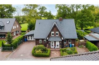 Wohnung kaufen in 26419 Schortens, Charmantes Zweifamilienhaus mit Wintergarten und Weitblick – solides Eigenheim in Friesland