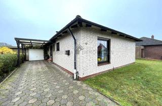 Haus kaufen in 26759 Hinte, KÄUFER GEFUNDEN Suurhusen – Wohnen auf einer Ebene! Gepflegter Bungalow mit Garten, Kamin und Garage