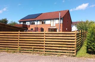 Doppelhaushälfte kaufen in Steinbeeke 48A, 31749 Auetal, Doppelhaushälfte im Auetal mit Doppelcarport und Kamin