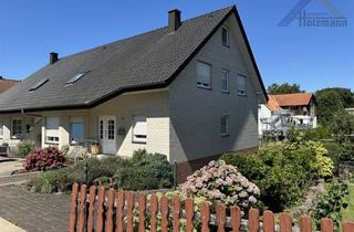 Doppelhaushälfte kaufen in 32602 Vlotho, Geräumige, unterkellerte Doppelhaushälfte in Vlotho - Holzmann Immobilien