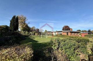 Haus kaufen in 24537 Gartenstadt, Unrenovierter Flachdach-Bungalow mit Garage in der alten Gartenstadt