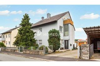 Einfamilienhaus kaufen in 97295 Waldbrunn, Waldbrunn - Vielseitiges Einfamilienhaus mit zwei Wohneinheiten, Garagen und Nebengebäude in ruhiger Lage