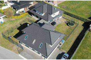 Haus kaufen in 26219 Bösel, Provisionsfrei - Attraktive Kapitalanlage: Vier Wohneinheiten in zwei Häusern in Bösel zu verkaufen