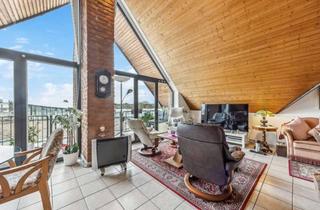 Wohnung kaufen in 40764 Langenfeld, Charmante 3-Zimmer-Dachgeschosswohnung mit Personenaufzug, Tiefgarage und Kamin in Langenfeld-Mitte