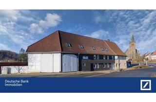 Mehrfamilienhaus kaufen in 37412 Herzberg, Mehrfamilienhaus mit drei vermieteten Wohnungen, zwei Garagen, großer Scheune und Garten direkt am