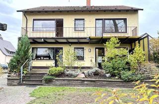 Haus kaufen in 68535 Edingen-Neckarhausen, Geräumiges Zweifamilienhaus mit 2 Garagen auf parkartigem Grundstück, direkt am Naturschutzgebiet