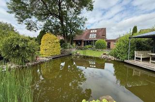 Haus kaufen in 25591 Ottenbüttel, LICHTDURCHFLUTET MIT PARKÄHNLICHEM GARTEN