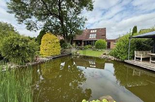 Einfamilienhaus kaufen in 25591 Ottenbüttel, Ottenbüttel - LICHTDURCHFLUTET MIT PARKÄHNLICHEM GARTEN