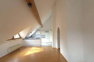 Wohnung kaufen in 71134 Aidlingen, Stilvolle 2-Zimmer-Dachgeschosswohnung mit offener Wohnküche, Luftraum & Balkonaussicht