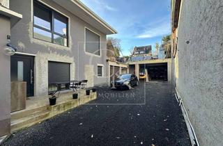 Einfamilienhaus kaufen in 56651 Niederzissen, (Teil-)saniertes Mehrfamilienhaus mit Ladenlokal, Garagen & Ausbaupotenzial – attraktive Rendite & Entwicklungsspielraum