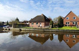 Haus kaufen in Loppersumerstraße 24, 26759 Hinte, Ruhig und direkt am Wasser: renovierter 4-Zimmer-Bungalow in Loppersum, Hinte.