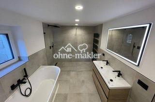 Wohnung kaufen in 91074 Herzogenaurach, Hochwertige 3-Zimmer-Souterrain-Wohnung mit Terrasse, Garten und 2 Stellplätzen