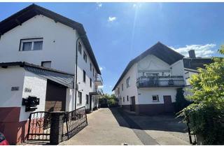 Haus kaufen in 63584 Gründau, Attraktives Wohnanwesen mit drei Wohneinheiten, Garagen, großem Innenhof und Garten!