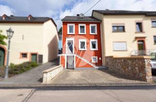 Einfamilienhaus kaufen in 54343 Föhren, Gemütliches Einfamilienhaus mit Terrasse und Hanggarten – Wohnen im Grünen