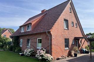 Haus kaufen in 26969 Butjadingen, Solides Zweifamilienhaus auf großem Grundstück in der Gemeinde Butjadingen/ Ortsteil Ruhwarden