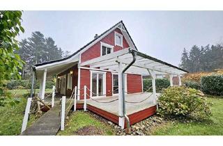 Haus kaufen in 27442 Gnarrenburg, immo-schramm.de: Neuwertiges Schwedenhaus mit Veranda und traumhafter Gartenanlage