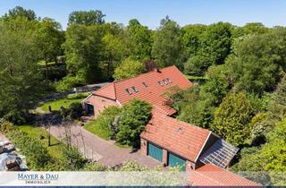 Einfamilienhaus kaufen in 26676 Barßel, Freistehendes Einfamilienhaus mit viel Platz und einer Einliegerwohnung direkt am Kanal, Obj. 9149