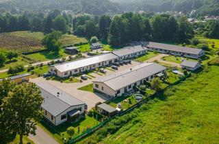 Haus kaufen in 16259 Falkenberg, Moderne und werthaltige Kapitalanlage! Zwölf Wohnungen und eine Gewerbeeinheit in Falkenberg