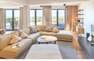 Wohnung kaufen in Hauptstraße 24, 18551 Glowe, Ferienimmobilie in Miteigentum: Gartenwohnung in erster Meereslinie mit Fitness-/Wellnessbereich