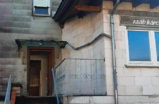 Einfamilienhaus kaufen in 63599 Biebergemünd, Biebergemünd - Ein mit einem Einfamilienhaus bebautes Grundstück