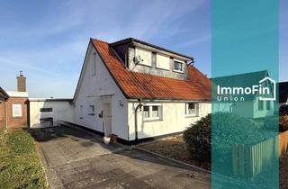 Einfamilienhaus kaufen in 26954 Nordenham, Gemütliches Einfamilienhaus mit Terrasse, Kaminofen und Feldblick