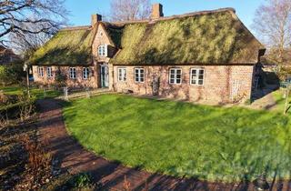Haus kaufen in 25920 Risum-Lindholm, Reetdachkate mit historischem Flair & Gartenidylle vereint