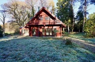Haus kaufen in 27404 Elsdorf, Wohnen am Waldrand - Holzhaus mit Wintergarten, Kamin und Naturgrundstück