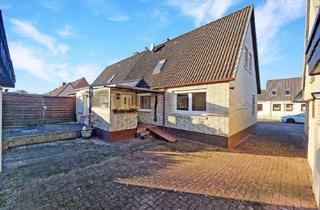 Doppelhaushälfte kaufen in 24647 Wasbek, gepflegtes und modernisiertes Wohnhaus mit Garagen und einem schönem Grundstück