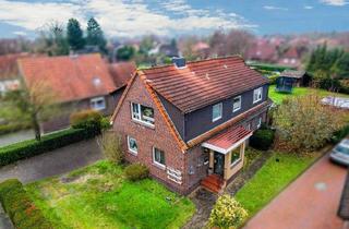 Haus kaufen in 26419 Schortens, Kapitalanlage: Gut vermietetes Zweifamilienhaus auf großem Grundstück!