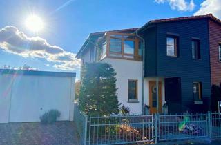 Doppelhaushälfte kaufen in 06749 Bitterfeld-Wolfen, Moderne Doppelhaushälfte mit Wellnessbad, überdachter Terrasse und Doppelgarage