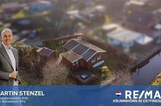 Haus kaufen in 26624 Südbrookmerland, „Auszeitdomizil“ am Großen Meer – idyllische Freizeitoase mit Steganlage und Kanalzugang