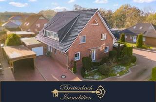 Haus kaufen in 27793 Wildeshausen, Zweifamilienhaus mit Komfortplus – Kamin, Garten, Terrasse und mehr