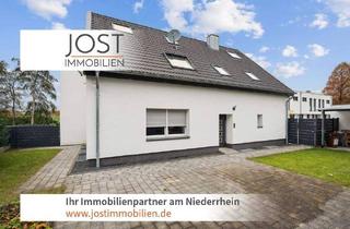 Haus kaufen in 41372 Niederkrüchten, Niederkrüchten - Neuwertig saniertes Zweifamilienhaus mit Garage, Terrasse und flexiblem Wohnkonzept