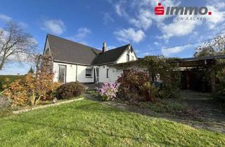 Einfamilienhaus kaufen in 52477 Alsdorf, Renovierungsbedürftiges Einfamilienhaus mit Garage und großem Süd-Grundstück