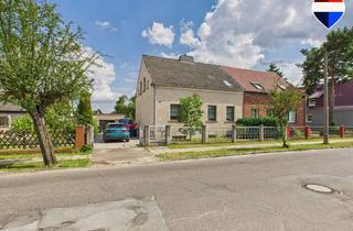 Doppelhaushälfte kaufen in 16269 Wriezen, Massiv errichtete Doppelhaushälfte mit Garage, Nebengelass und Garten
