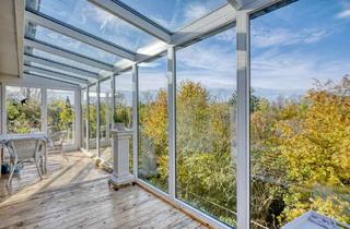 Haus kaufen in 41517 Grevenbroich, Bungalow mit Wintergarten und Einliegerwohnung