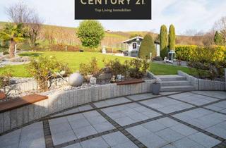 Einfamilienhaus kaufen in 55296 Gau-Bischofsheim, Licht, Luxus & Natur: Einfamilienhaus in Feldrandlage - mit Sauna, Wintergarten & Einliegerwohnung