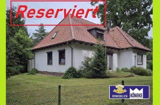 Haus kaufen in 28816 Stuhr, Stuhr - Walmdach Winkelbungalow mit Teilkeller, Doppelgarage, in begehrter Lage in Fahrenhorst