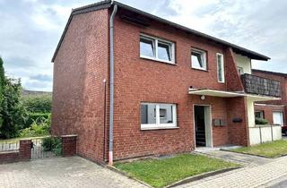 Haus kaufen in 41569 Rommerskirchen, Rommerskirchen - Modernisiertes Zweifamilienhaus mit vielen Nutzungsmöglichkeiten