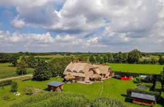 Haus kaufen in 26624 Südbrookmerland, Südbrookmerland - Idyllisches Reetdachanwesen in traumhafter Alleinlage!