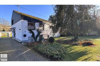 Einfamilienhaus kaufen in 56567 Neuwied, Neuwied - Freistehendes Einfamilienhaus mit Einliegerwohnung, Doppelgarage und parkähnlichem Garten